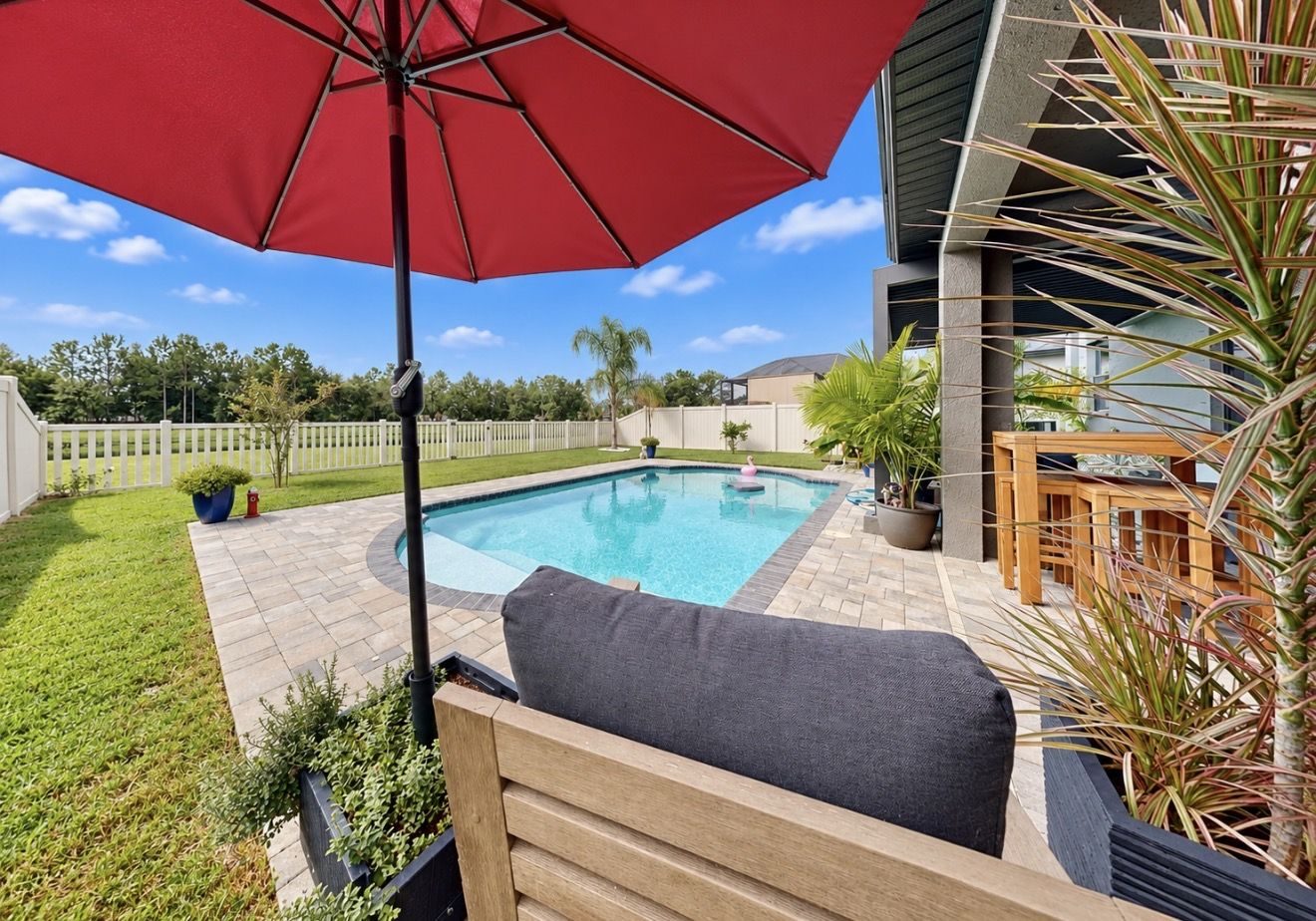 Paver pool deck and fenced yard